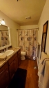 The master bathroom has a tub/shower. It is privately off the master bedroom.