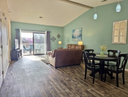 Both the Dining Area and Living Room boast vaulted ceilings, enhancing the open design. Additionally, the Living Room and Master Bedroom provide direct access to the Back Porch.