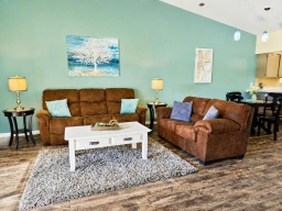 The 3-seat couch boasts two built-in recliners, perfect for lounging.