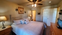 Master Bedroom has a King Size Bed with Cable TV & Free Wi-Fi. Walk out to the Enclosed Porch from the Bedroom. Bathroom with Jacuzzi Tub/Shower adjoining the Bedroom.
