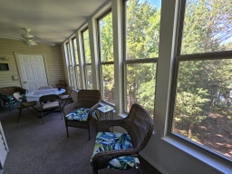 Bask in the beauty of our enclosed sunroom by the lake. Play checkers or choose from a selection of games, all while enjoying the peaceful ambiance!