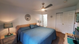 The master bedroom has a King bed, flat screen TV, cable, free Wi-Fi and a bathroom adjoining the bedroom.