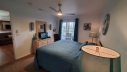 The master bedroom has a King bed, flat screen TV, cable, free Wi-Fi and a bathroom adjoining the bedroom. Walk out to the enclosed sun room for a cup of coffee or enjoy an evening game of Checkers.