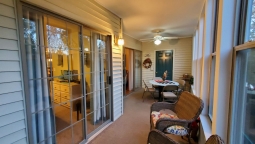 You can walk out to the enclosed sun room from the master bedroom or living room. Under the TV there are games and movies. Enjoy a game of checkers.
