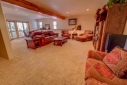 The family room has a stereo, flat screen Satellite TV and a walk-out deck.