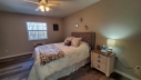 Relax in this classy and comfortable guest bedroom with an adjoining bathroom.