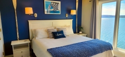 Wake up to stunning vistas of Table Rock Lake right outside your master bedroom window as you unwind in bed.