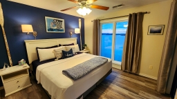 Experience unforgettable moments in this charming remodeled lake condo, complete with a king bed, a closet equipped with a dresser, hangers, and essential items like an iron and ironing board for your convenience.