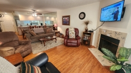 Unwind in this charming living room, featuring three inviting rocker recliners and a cozy couch that conveniently transforms into a sofa sleeper.