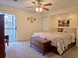 The master bedroom has a nice King-size bed, flat screen TV with cable. The master bathroom adjoins the bedroom. Walk out to the screened-in porch from the master bedroom.
