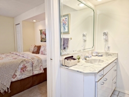 The master bathroom, conveniently connected to the bedroom, features a jetted tub and a spacious shower.