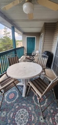 The spacious back porch has an electric grill for that afternoon barbecue.