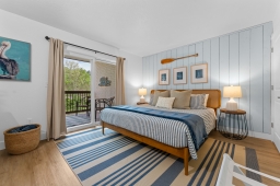 Experience comfort in our bedroom with a king-size bed, Amazon Fire TV, and streaming services like Hulu and Netflix. Enjoy the peaceful Roark Creek view for a rejuvenating escape!