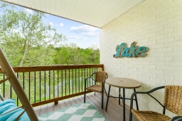 Experience bliss on the balcony with a delightful couples swing seat and a small table. Perfect for enjoying your morning coffee while surrounded by the soothing sounds of the creek and nature.