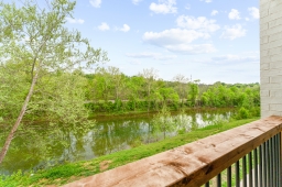 Relax on the balcony with stunning views of Roark Creek. Your peaceful retreat awaits!