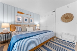 Find everything you need in the bedroom closet: an iron, ironing board, hangers, plus extra pillows and blankets for a cozy and hassle-free experience!