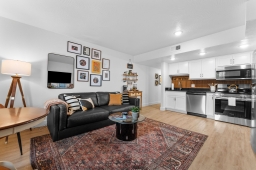 The adjoining kitchen is designed for convenience, featuring modern appliances and generous counter space for all your cooking needs.