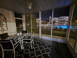 The Sunroom overlooks the shared outdoor swimming pool.