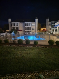 The Sunroom overlooks the shared outdoor swimming pool.