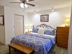 The Master Bedroom features a spacious King-size bed, a flat-screen cable TV, and complimentary Wi-Fi. The private Master Bathroom is conveniently located just off the bedroom, and you can step out onto the deck directly from this serene space.